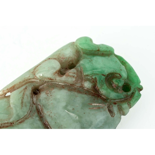 96 - Chinese Green Jade Pendant 

Depicting a stylised beast climbing a tree of wisdom, 51mm long, 39gram... 