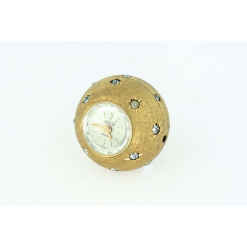 98 - Gold Plated Pendant Aureole Swiss Watch With Gems 

An elegant watch pendant in the shape of a spher... 