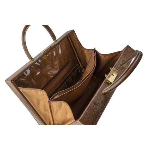 145 - A Crocodile Leather Travel Bag  

A crocodile-patterned travel bag featuring a lock and key mechanis... 