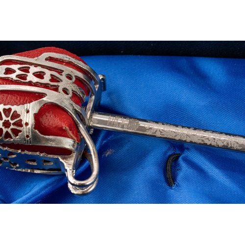 149 - A Pair Of Wilkinson Miniature Swords  

Comprising a highland regiment pattern basket hilted sword a... 