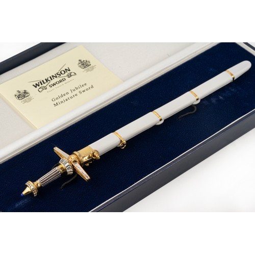 150 - A Wilkinson Sword Golden Jubilee Miniature Sword  

An ornate cross hilted sword to commemorate HM Q... 