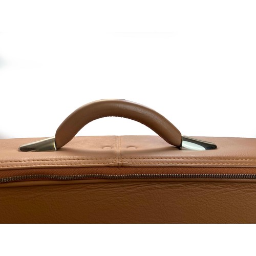 168 - A Maserati Suitcase

A tan leather case featuring stitched grille pattern and Maserati Trident badge... 