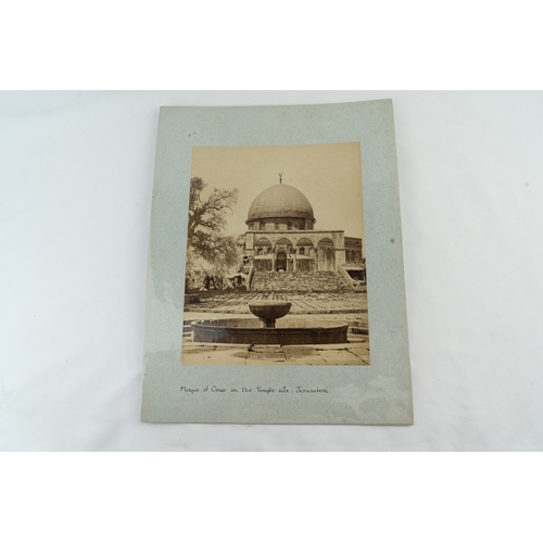 29 - TWO PHOTOS OF OMAR MOSQUE 
Comprising vertically-oriented monochromatic photographs, the images port... 