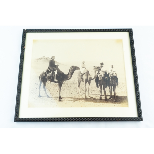 56 - A FRAMED PICTURE, “DESERT MEN ON CAMELS”

A monochrome photograph that encapsulating the essence of ... 