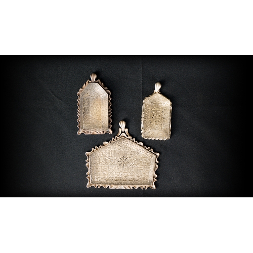 98 - THREE FASCINATING ROCK CRYSTAL PENDANTS

A Large Engraved Rock Crystal Pendant, Iran, 20th Century 
... 