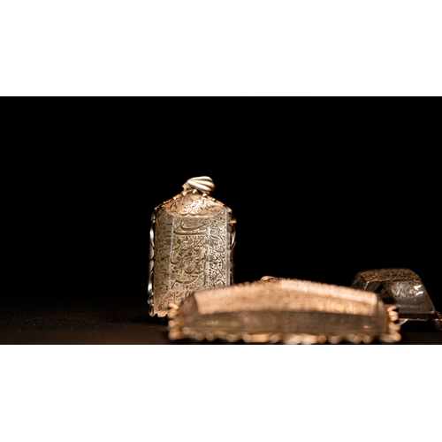 98 - THREE FASCINATING ROCK CRYSTAL PENDANTS

A Large Engraved Rock Crystal Pendant, Iran, 20th Century 
... 