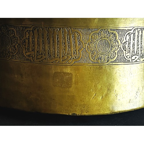 107 - A LARGE MAMLUK BRASS BASIN, 

With high body bowl and flaring mouth,  engraved  large thuluth inscri... 