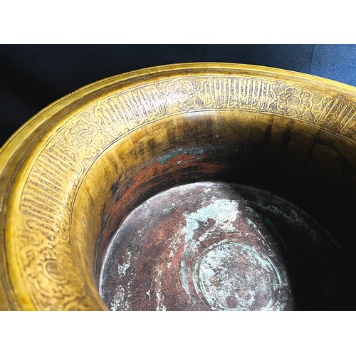 107 - A LARGE MAMLUK BRASS BASIN, 

With high body bowl and flaring mouth,  engraved  large thuluth inscri... 