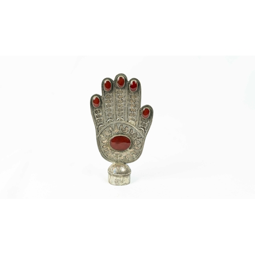 A SILVER BANNER (ALAM) IN THE FORM OF THE HAND OF FATIMA, HAMSA, ANATOLIA TURKEY, 20TH CENTURY, Of typical form, standing on a domed foot, engraved with beadings, set I the centre with a large agate stone and five relatively smaller ones at the tip of fingers, 39 gram, 12.5cm high