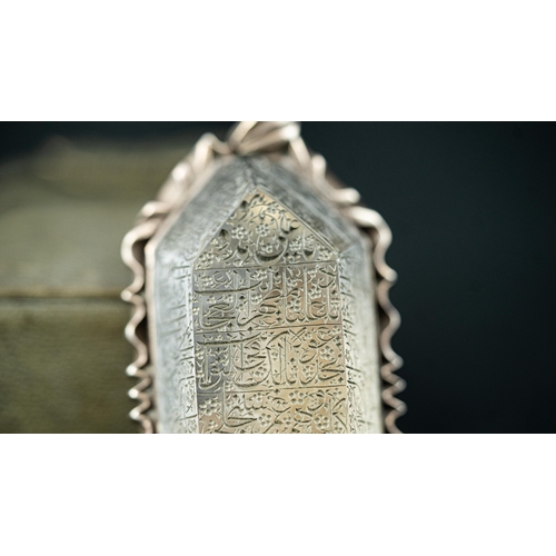 17 - AN ENGRAVED ROCK CRYSTAL PENDANT, IRAN, 20TH CENTURY Of tapered rectangular
 form, raised flat rock ... 