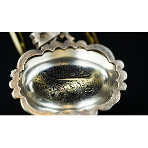 20 - AN OVAL FORM SILVER FRAMED DOMICAL ROCK CRYSTAL PENDANT, IRAN Of oval form, the crystal surface carv... 