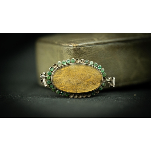 25 - A PERSIAN MUSTARD COLOUR AGATHE AMULET The oval form amulet, the mustard ground engraved with Arabic... 