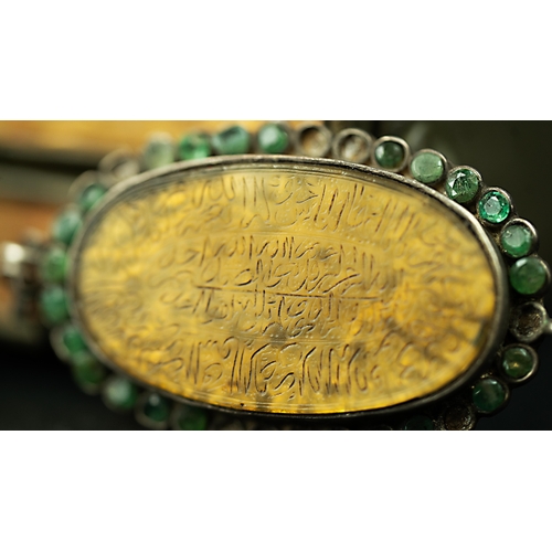 25 - A PERSIAN MUSTARD COLOUR AGATHE AMULET The oval form amulet, the mustard ground engraved with Arabic... 