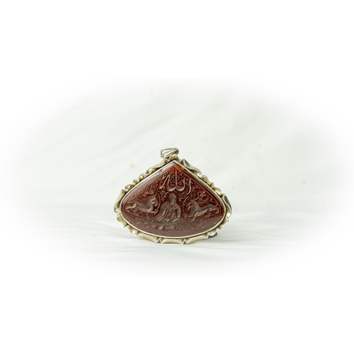 4 - A SILVER FRAMED CARVED AGATE PENDANT IRAN, TAHRAN. Of wide drop form, depicting Imam Ali with Zulfik... 