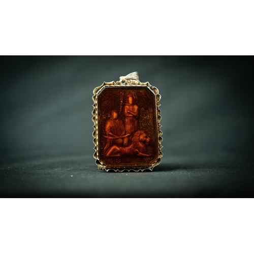 5 - A SILVER FRAMED CARNELIAN CARVED PENDANT IRAN, TAHRAN Of rectangular form, with a background depicti... 