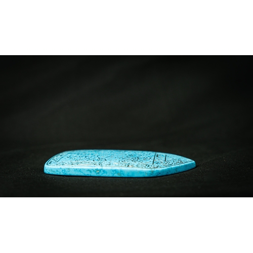 102 - A CARVED BLUE HARDSTONE TALISMANIC OBJECT WITH ARABIC INSCRIPTION, Of rectangular shape with a point... 