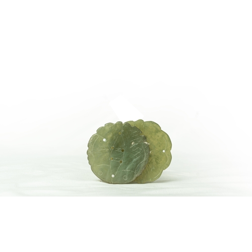 105 - TWO PALE GREEN JADE SASH CORD ORNAMENT, Pale jade sash cord ornaments or pendants, one with flower d... 