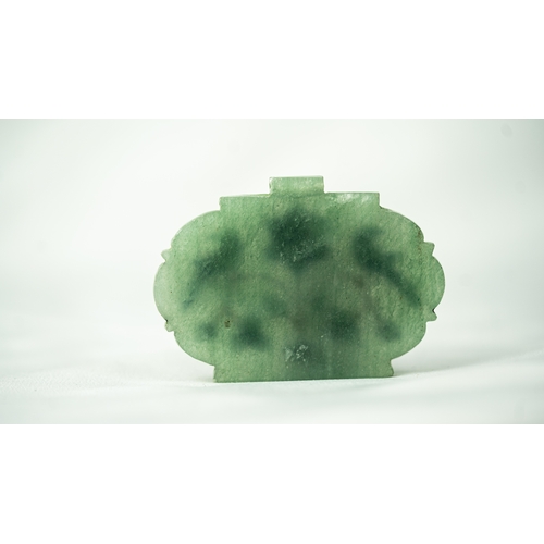 115 - AN INDIAN PALE GREEN JADE PENDANT, Of oval form, with a floral motif with two birds perched on the b... 