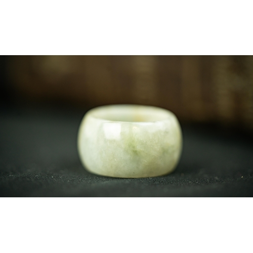 116 - TWO PALE GREEN JADE RINGS, One wide and one narrow bands of green jade rings   16 gr, 
2,3 cm, 2,2 c... 