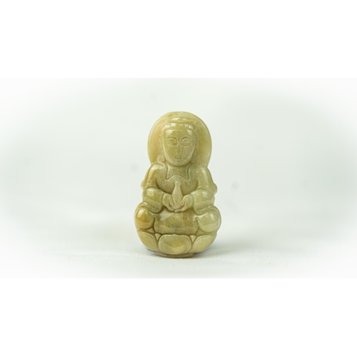 120 - AN INDIAN JADE BUDISM ORNAMENT, Carved with a serene expression, seated in dhyanasan, holding a bott... 