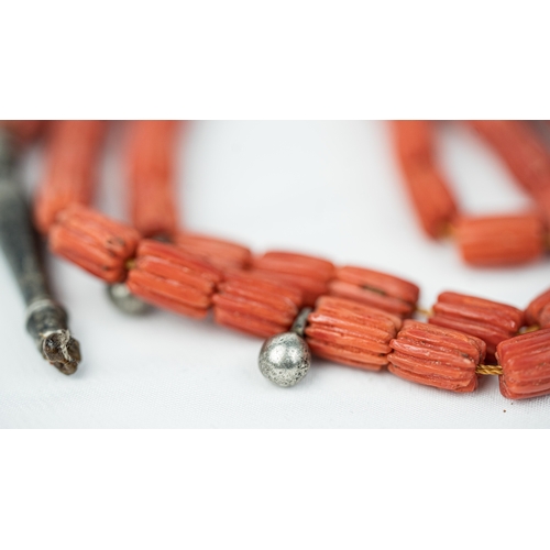 63 - CORAL PRAYER BEADS, 18TH/19TH CENTURY The strung 65 striped carved beads, two silver ball stops, sil... 