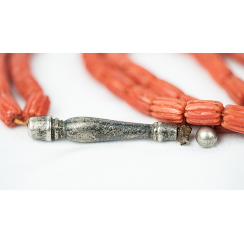 63 - CORAL PRAYER BEADS, 18TH/19TH CENTURY The strung 65 striped carved beads, two silver ball stops, sil... 