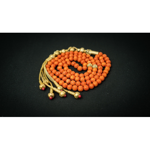 64 - CORAL PRAYER BEADS,18TH/19TH CENTURY, The tasbih strung  with 99  spherical  beads,gold and silver e... 