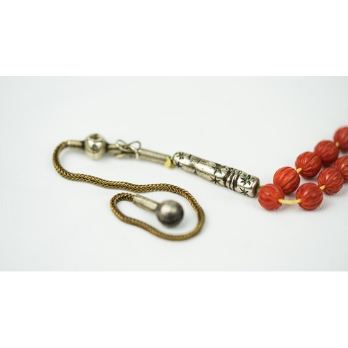 66 - CORAL PRAYER BEADS, 18TH/19TH CENTURY, The tasbih strung  with 99 spherical carved beads, silver sto... 