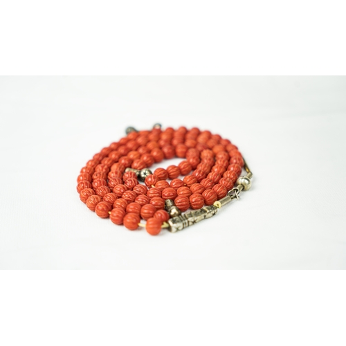 66 - CORAL PRAYER BEADS, 18TH/19TH CENTURY, The tasbih strung  with 99 spherical carved beads, silver sto... 