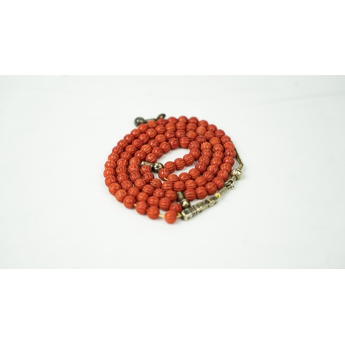 66 - CORAL PRAYER BEADS, 18TH/19TH CENTURY, The tasbih strung  with 99 spherical carved beads, silver sto... 