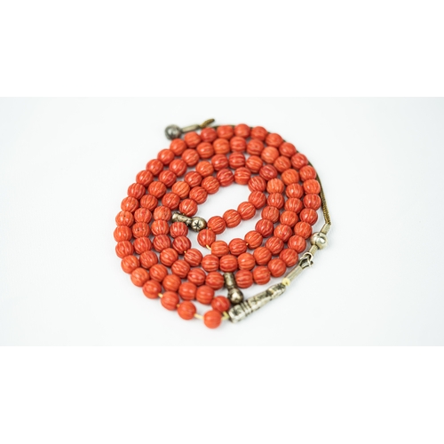 66 - CORAL PRAYER BEADS, 18TH/19TH CENTURY, The tasbih strung  with 99 spherical carved beads, silver sto... 