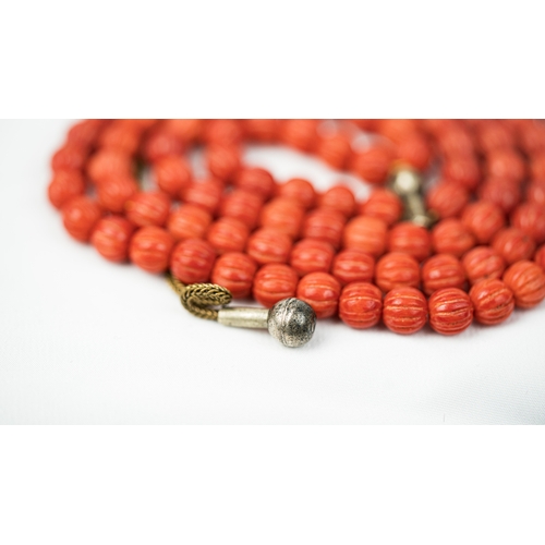 66 - CORAL PRAYER BEADS, 18TH/19TH CENTURY, The tasbih strung  with 99 spherical carved beads, silver sto... 