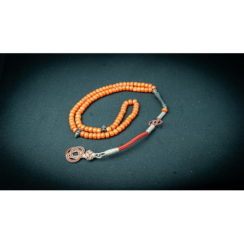 68 - A CORAL PRAYER BEADS, 18TH/19TH CENTURY, The tasbih strung  with 99 flatted spherical coral beads, s... 