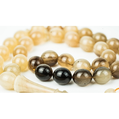 70 - The tasbih strung  with 33  ovoid  beads, flat stops, narrowing and nicely elongating imama,  precee... 