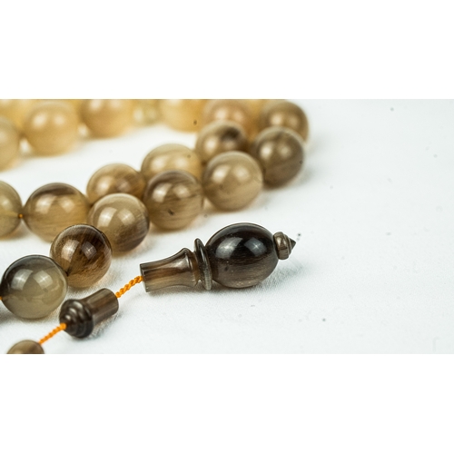 70 - The tasbih strung  with 33  ovoid  beads, flat stops, narrowing and nicely elongating imama,  precee... 