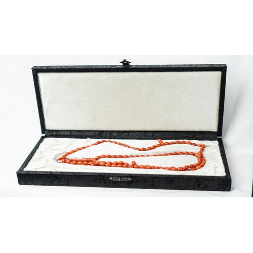 71 - A SET OF CORAL BEADS AND TURBAN FINIAL, A coral prayer beads, 99 beads for Muslim prayers, set in it... 