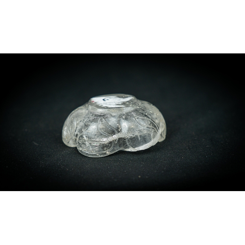 75 - A ROCK CRYSTAL TINY BOWL, Of irregular shape, resting on a flat base, with wavy rim, 100gr, 7,5 cm w... 