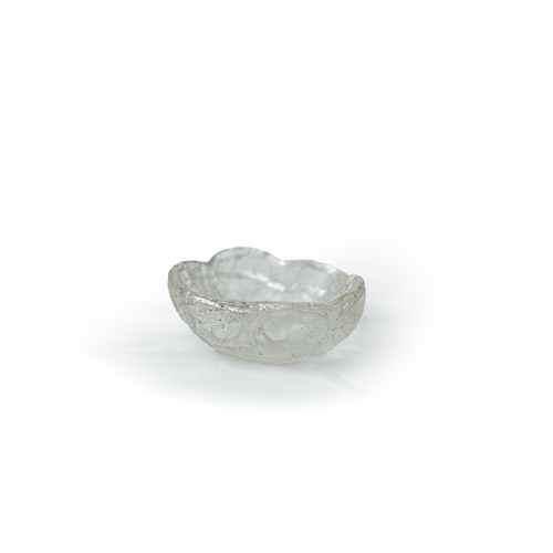 75 - A ROCK CRYSTAL TINY BOWL, Of irregular shape, resting on a flat base, with wavy rim, 100gr, 7,5 cm w... 