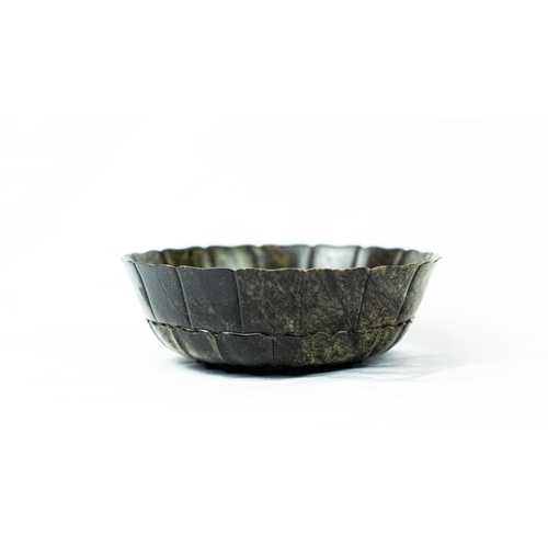 78 - A MUGHAL STYLE DARK GREEN JADE LOBBED BOWL, INDIA, 19TH CENTURY Of deep rounded
 form with petals ri... 