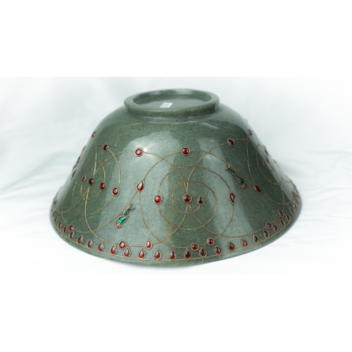 83 - A GEM SETTED PALE GREEN JADE BOWL, Of conical form, rising from short foot, the exterior decorated w... 