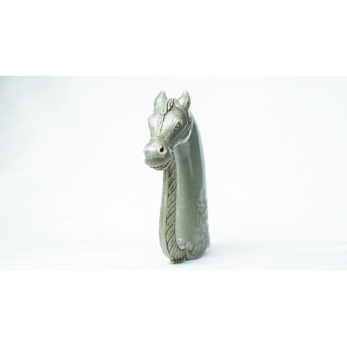 91 - A HORSE HEADED PALE GREEN JADE HILT, The hilt carved in fine green jade, in the form of a horse’s he... 