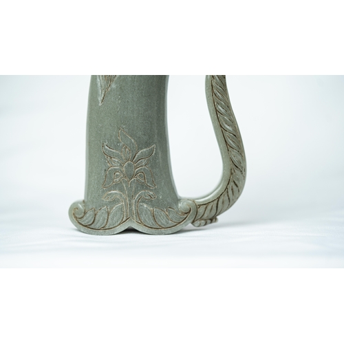 91 - A HORSE HEADED PALE GREEN JADE HILT, The hilt carved in fine green jade, in the form of a horse’s he... 