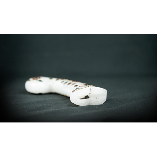 93 - A GEM SET WHITE JADE HILT, The carved white jade pistol-grip hilt inlaid with gold wire with bands o... 