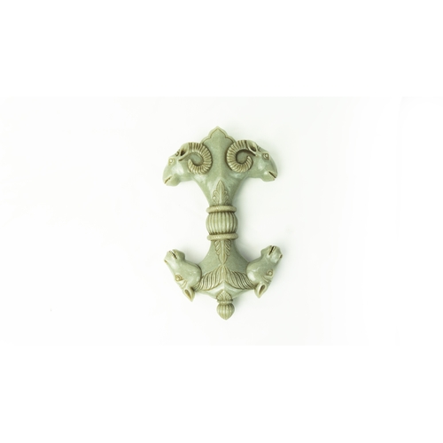 96 - DOUBLE SIDED PALE GREEN OBJECT, A Mughal style carved green jade handle, one end with double-headed ... 