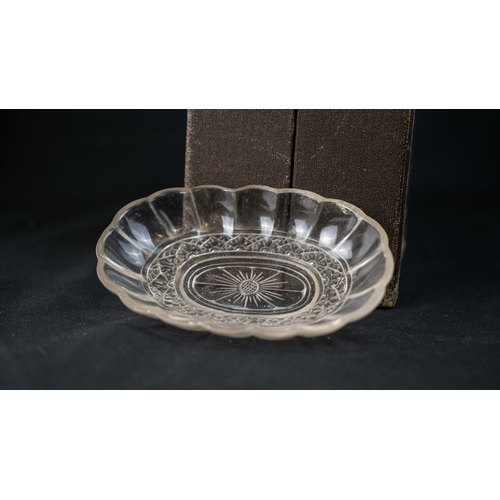 97 - CRYSTAL LOBBED BOWL, Of oval shape, with lobed sides, resting on a flat base, with flowerhead base