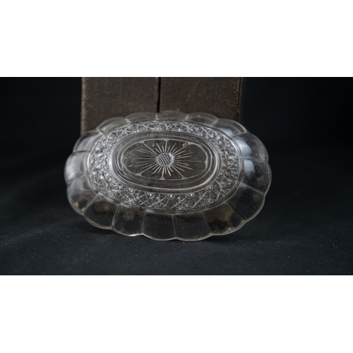 97 - CRYSTAL LOBBED BOWL, Of oval shape, with lobed sides, resting on a flat base, with flowerhead base