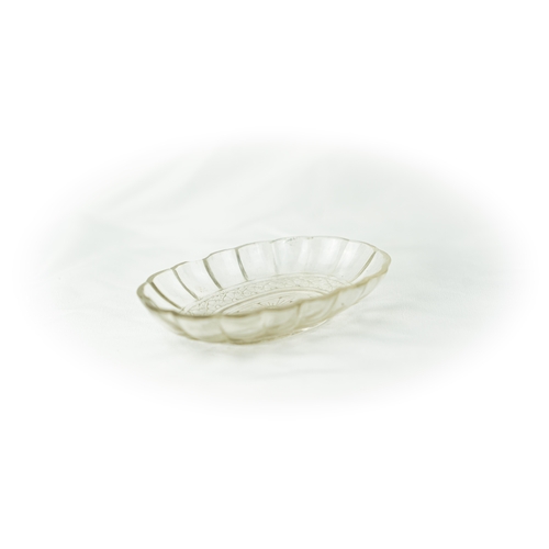 97 - CRYSTAL LOBBED BOWL, Of oval shape, with lobed sides, resting on a flat base, with flowerhead base