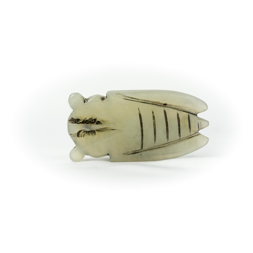 122 - A PALE GREEN CARVED JADE SCARABEE SHAPE ORNAMENT, An Egyptian green scarab, intricately carved and t... 