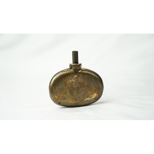 124 - A SHELL- SHAPED TOMBAK POWDER FLASK OTTOMAN TURKEY, 19TH CENTURY, Comprising a small shell-shaped To... 