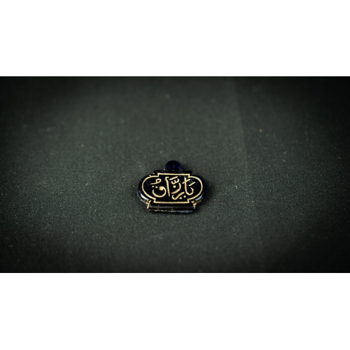 132 - A BLACK STONE PENDANT WITH ARABIC INSCRIPTION IN GOLD, AUSTRIA, FOR OTTOMAN MARKET, Of oval form, Ar... 